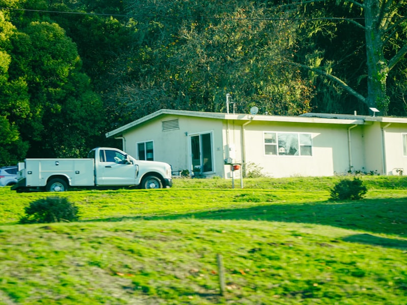 White work truck at a residential property representing I Can Do That! Handyman Services